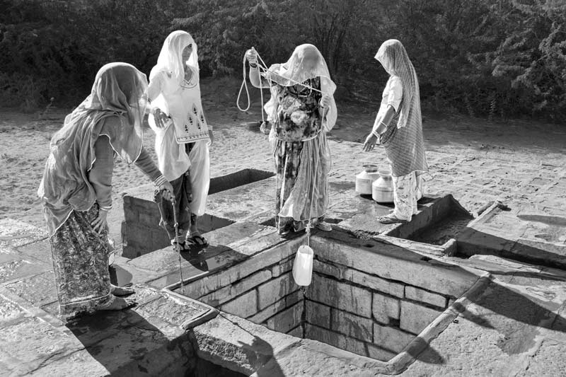 Nature-based Solutions for Drinking Water - shallow well ('beri') recharged by an adjacent 'khadin' used by women for procuring drinking water in Jaisalmer district, Rajasthan